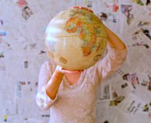 Woman holding globe