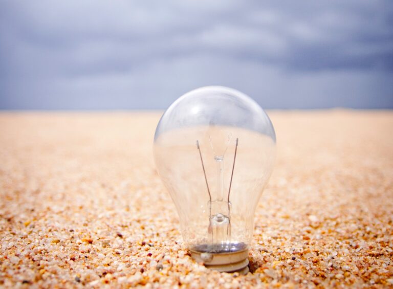 Lightbulb in sand
