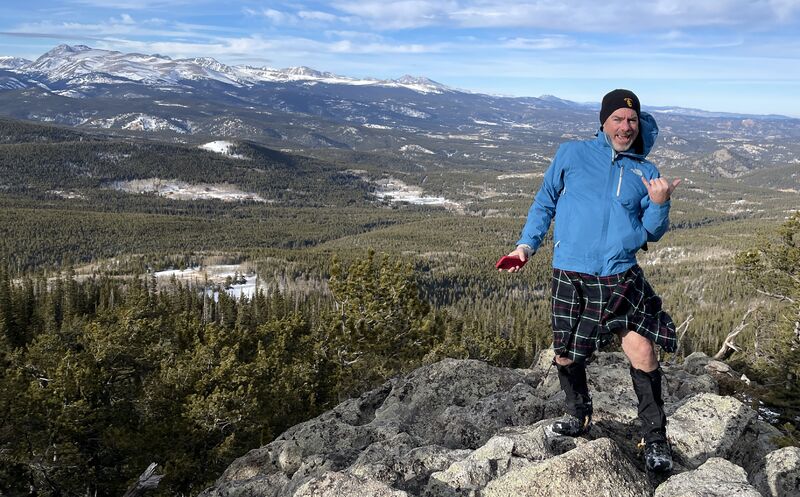 Jeff Kinsey wearing a kilt to hike and explore a peak.