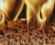 e you sent depicts a close-up view of wood pellets that are on fire, with flames dancing above them