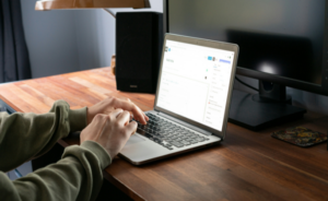 A person typing on a laptop