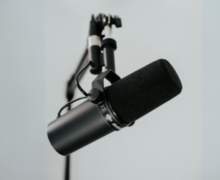 A microphone with a tripod attached to it.