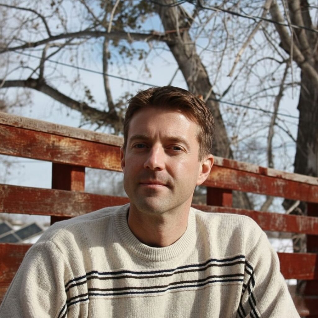 Bret Orton, Co-Founder of Relish Studio headshot outdoors in front of fence