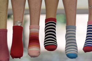 Line of women wearing socks.